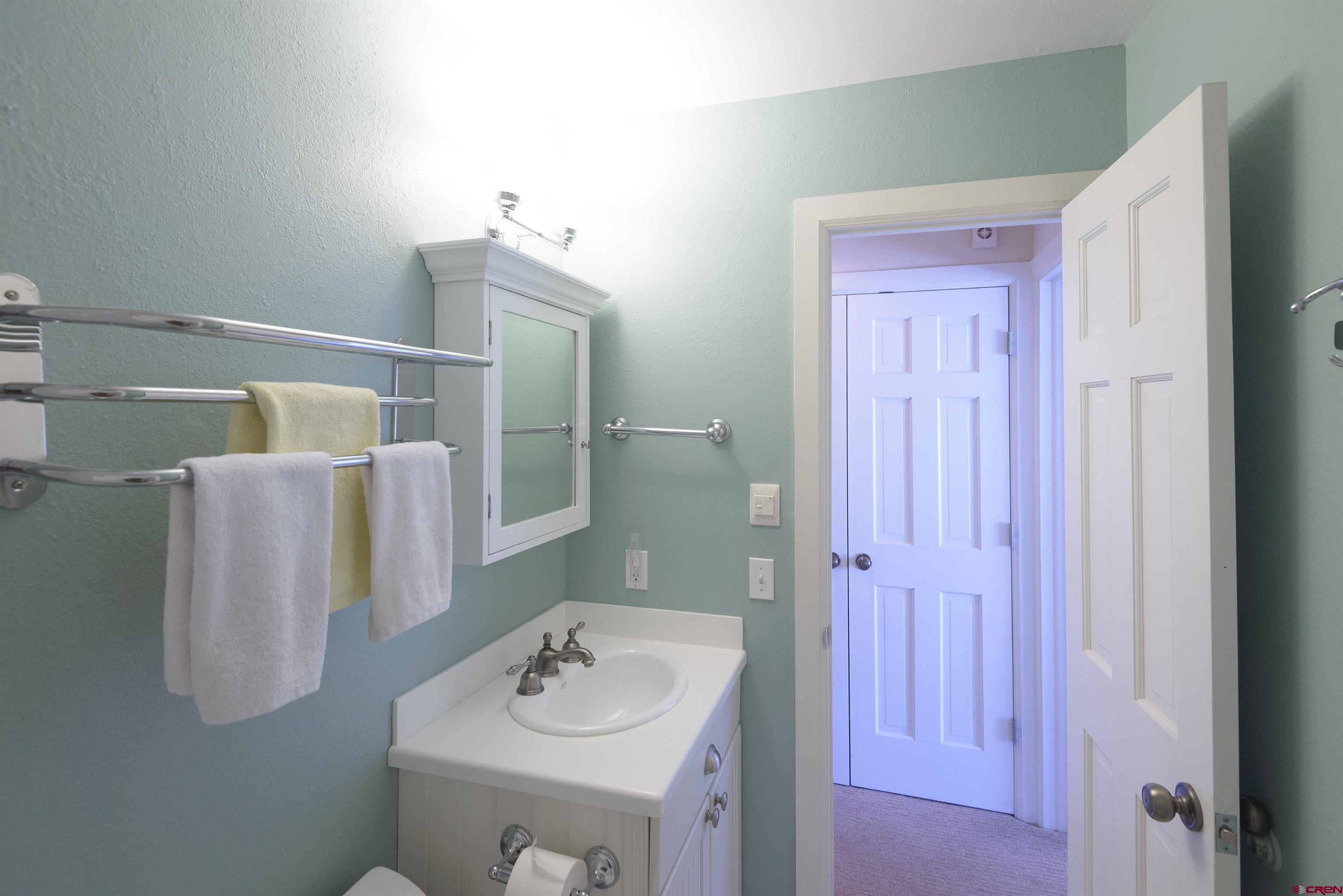 12 Snowmass Road, Unit 416 Crested Butte, CO 81225 - Photo 27 of 35 a bathroom with a sink and a mirror