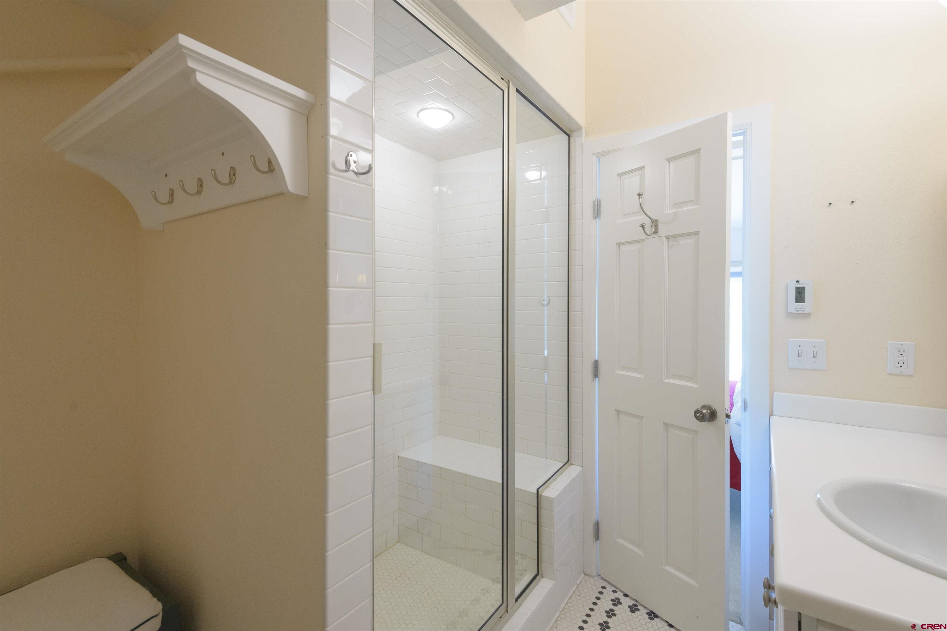 12 Snowmass Road, Unit 416 Crested Butte, CO 81225 - Photo 33 of 35 a bathroom with a shower and toilet