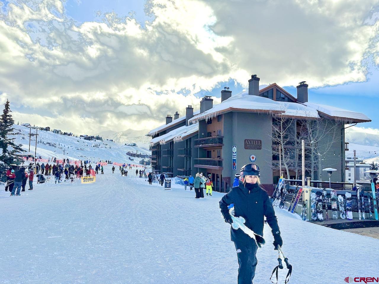 12 Snowmass Road, Unit 416 Crested Butte, CO 81225 - Photo 4 of 35 a view of group of people on a street