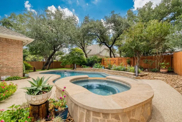 a view of a swimming pool with a patio