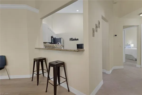 a view of kitchen with furniture and wooden floor