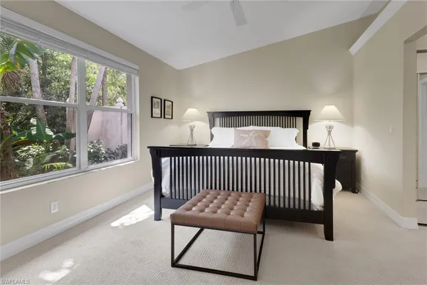 a bedroom with furniture and a window