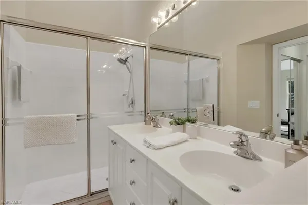 a bathroom with a double vanity sink mirror and double