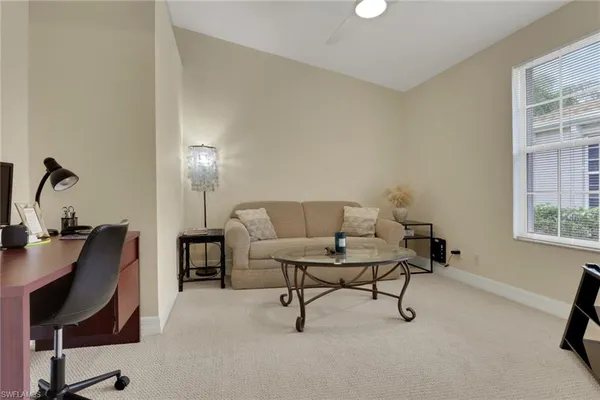 a view of a workspace with furniture