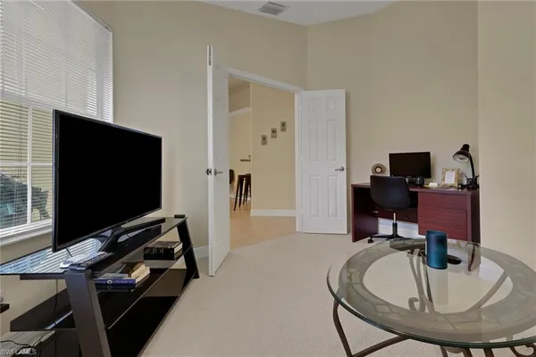 a room with furniture and a flat screen tv