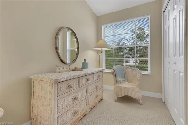 a bathroom with a toilet a sink and a mirror