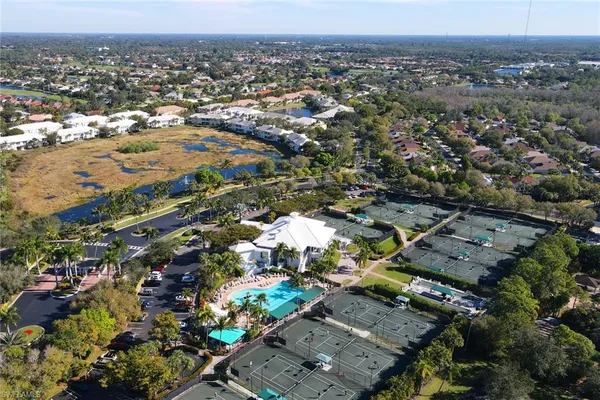 an aerial view of a house with a swimming pool