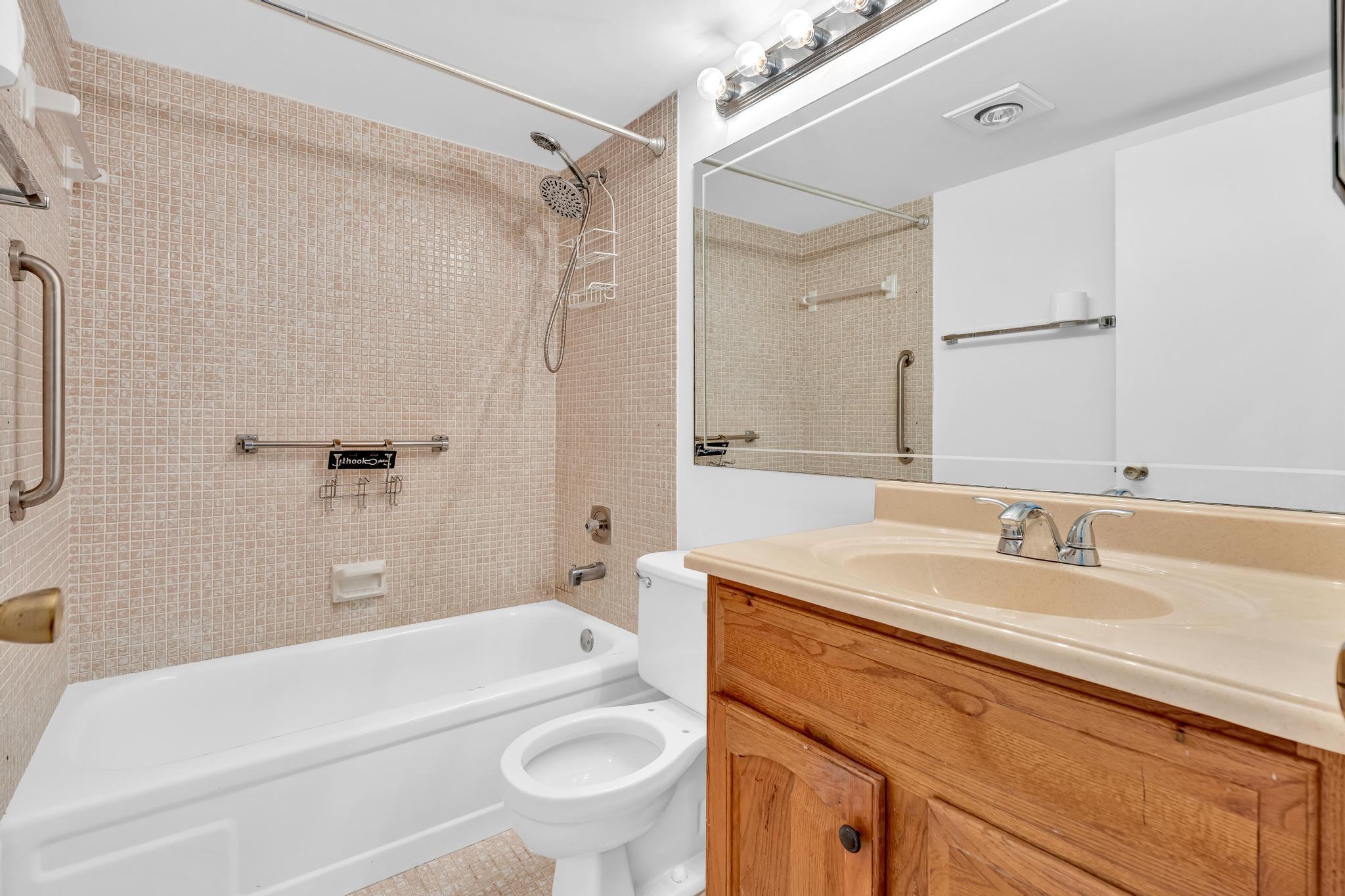 2066 Exeter Boca Raton, FL 33434 - Photo 17 of 60 a bathroom with a sink a toilet and a bathtub