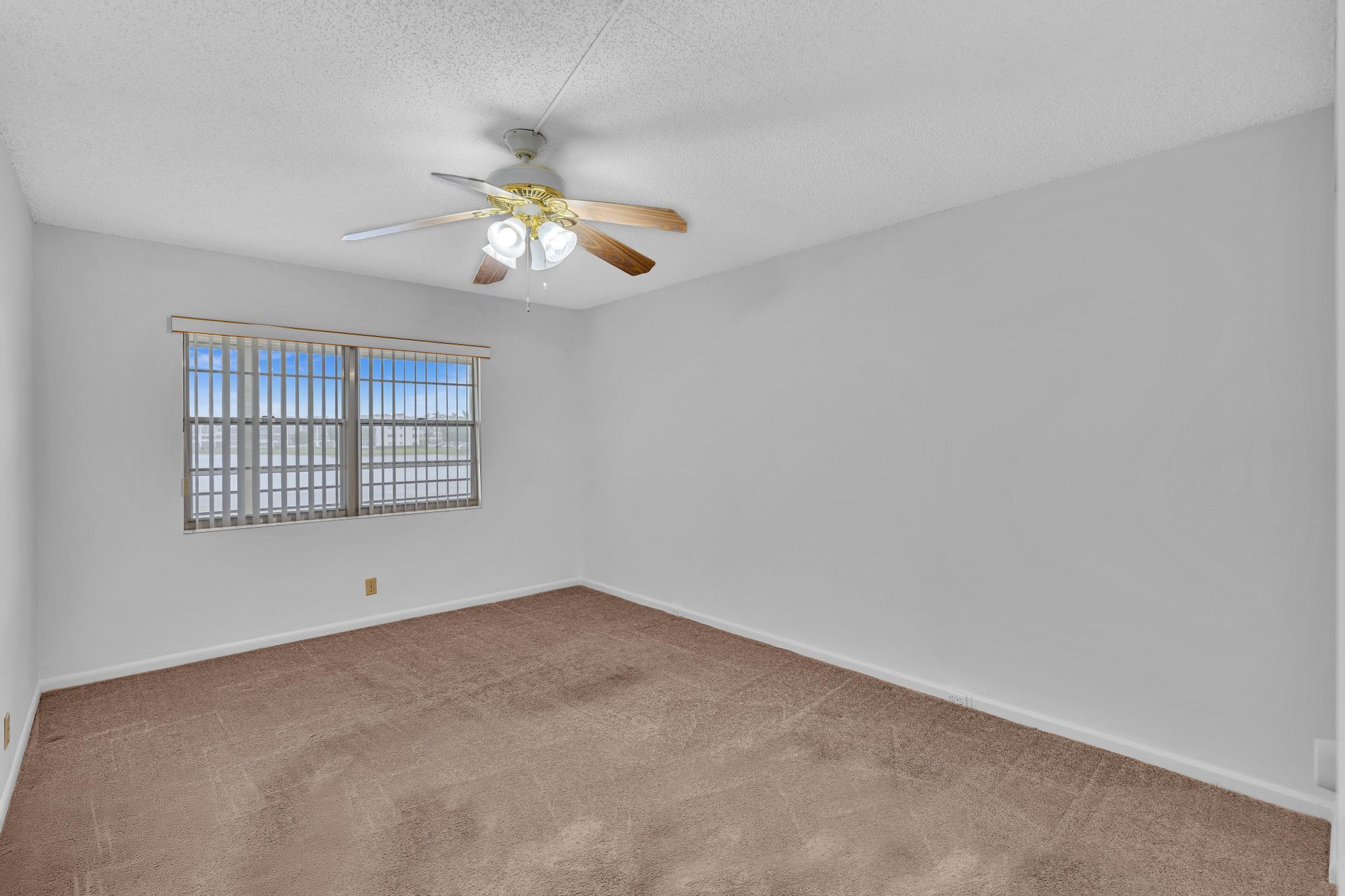 2066 Exeter Boca Raton, FL 33434 - Photo 18 of 60 a view of an empty room with a window