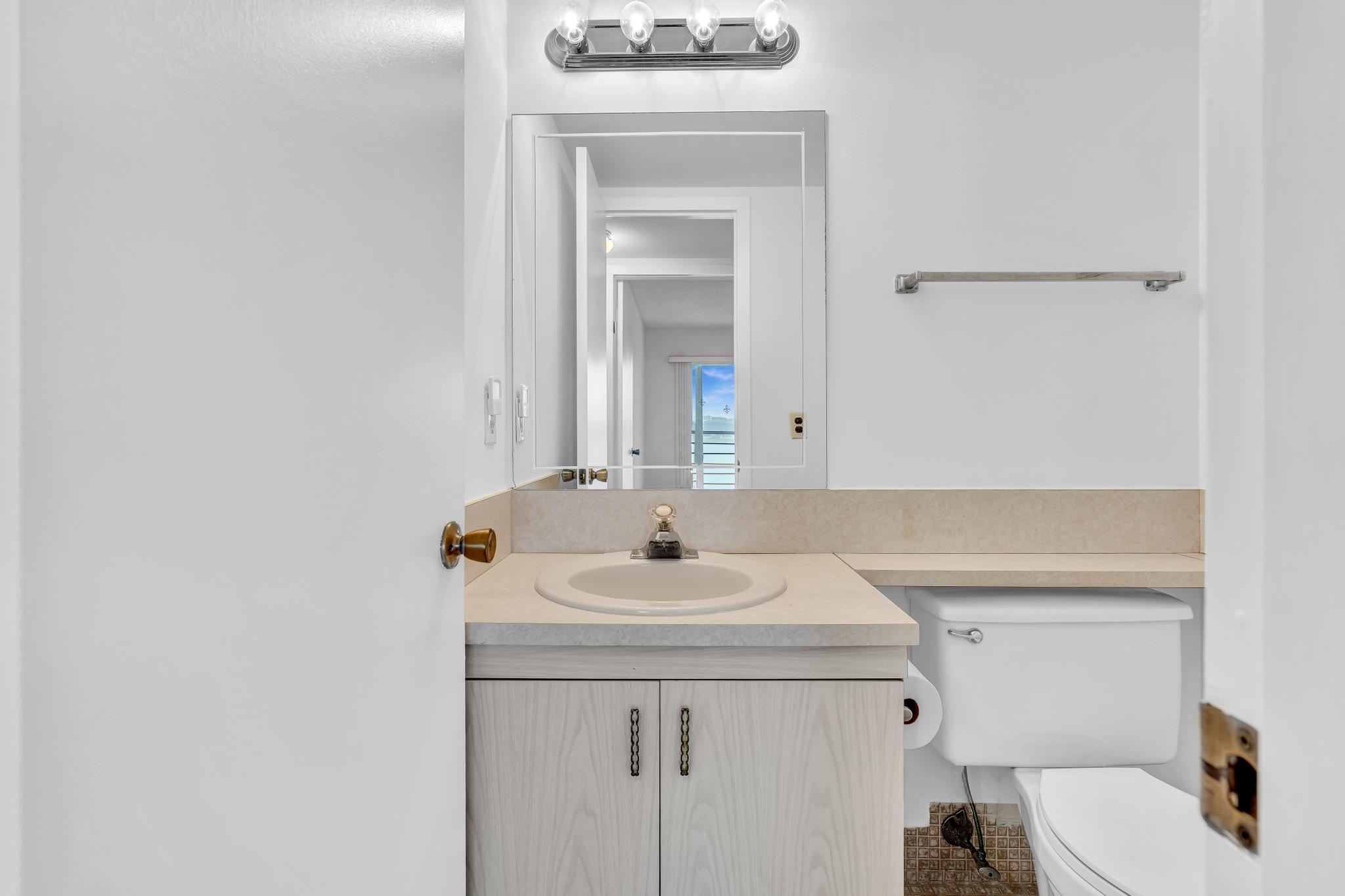 2066 Exeter Boca Raton, FL 33434 - Photo 23 of 60 a bathroom with a sink and a toilet