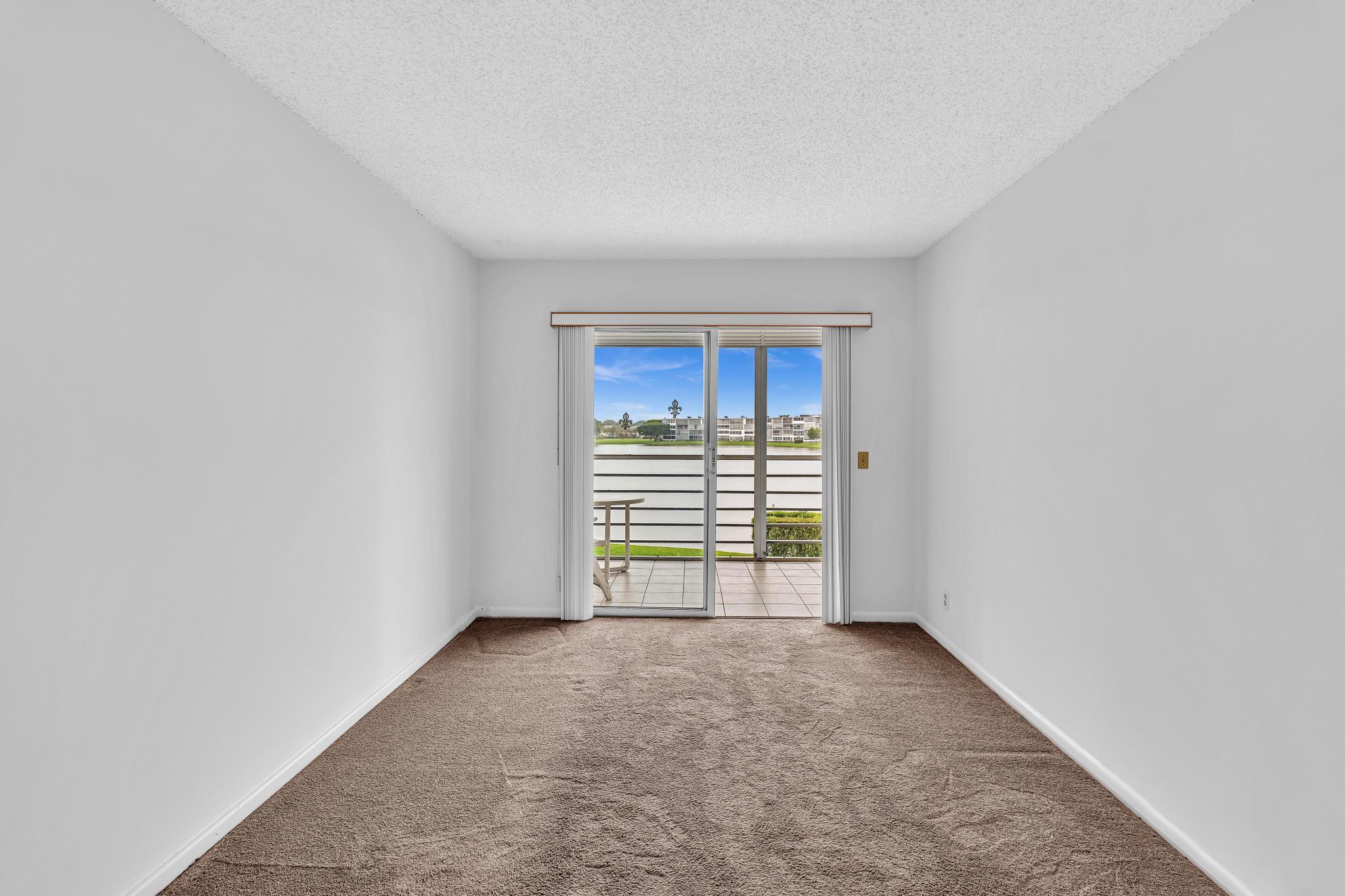 2066 Exeter Boca Raton, FL 33434 - Photo 27 of 60 a view of an empty room with a window