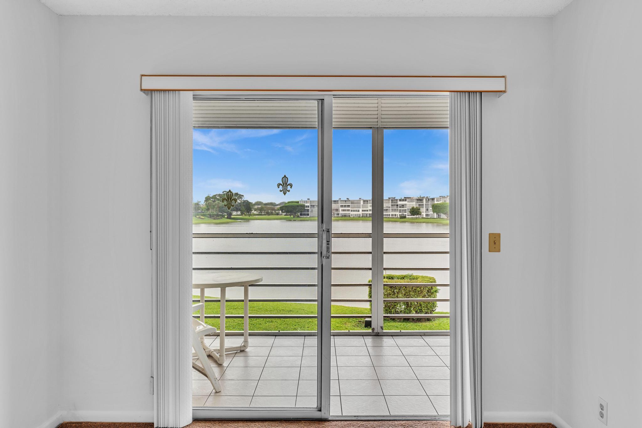 2066 Exeter Boca Raton, FL 33434 - Photo 28 of 60 a view of a glass door with a outdoor space