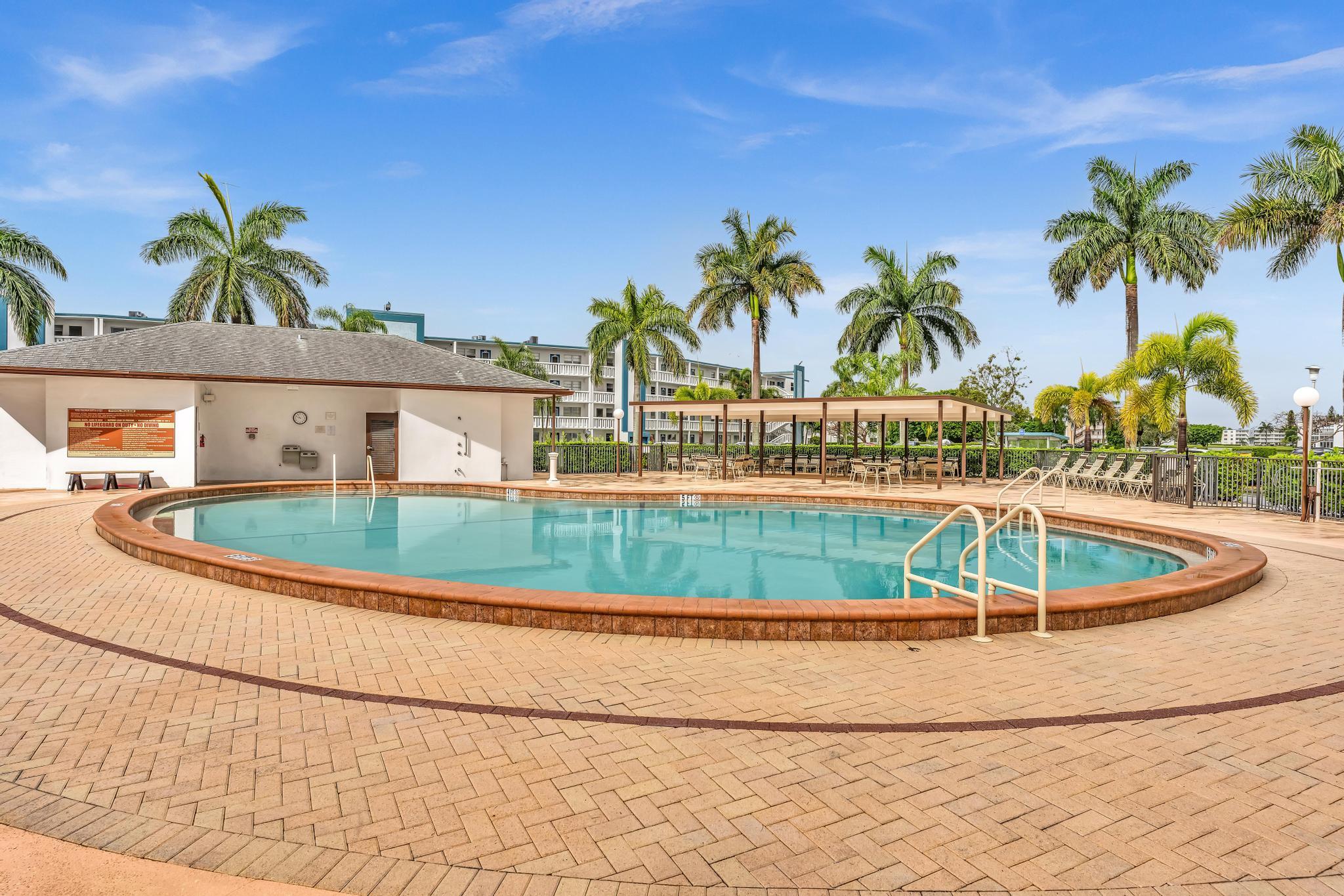 2066 Exeter Boca Raton, FL 33434 - Photo 34 of 60 a view of a house with a swimming pool and sitting area