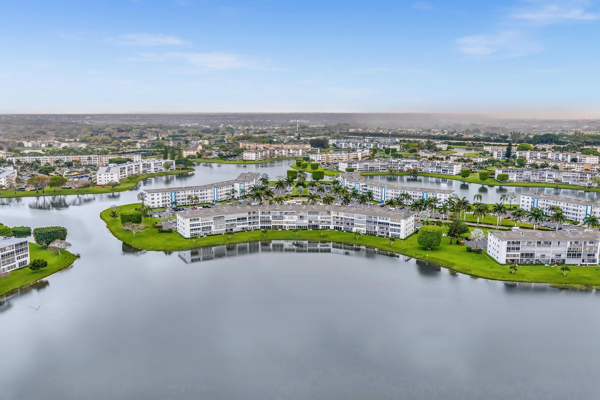 2066 Exeter Boca Raton, FL 33434 - Photo 36 of 60 an aerial view of a house with a garden and lake view