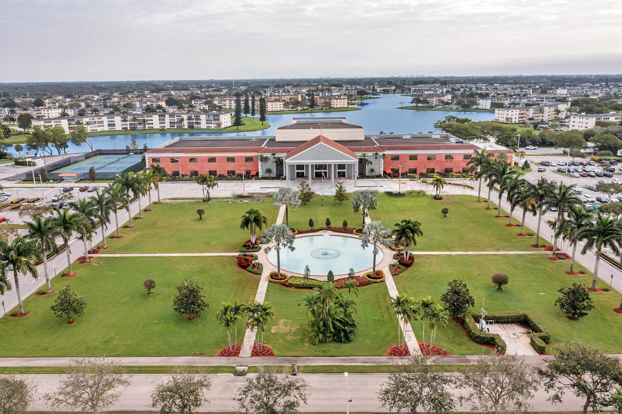 2066 Exeter Boca Raton, FL 33434 - Photo 42 of 60 an aerial view of a city with lots of residential buildings ocean and mountain view in back