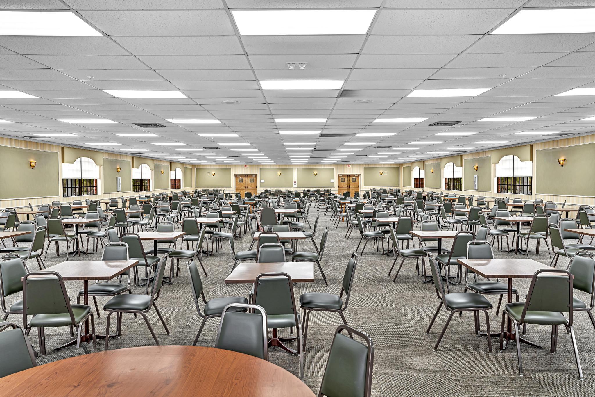 2066 Exeter Boca Raton, FL 33434 - Photo 56 of 60 a group of people sitting at tables in a room