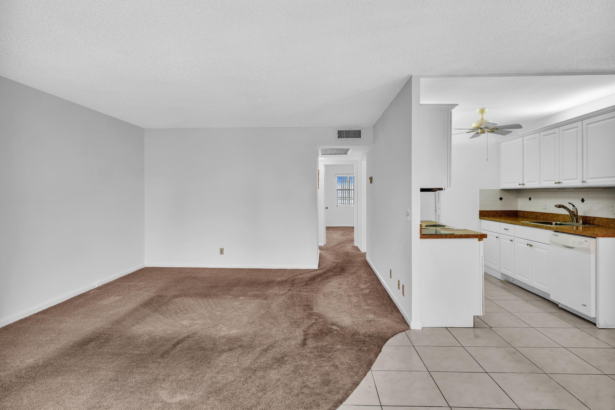 2066 Exeter Boca Raton, FL 33434 - Photo 6 of 60 a view of a kitchen with white cabinets