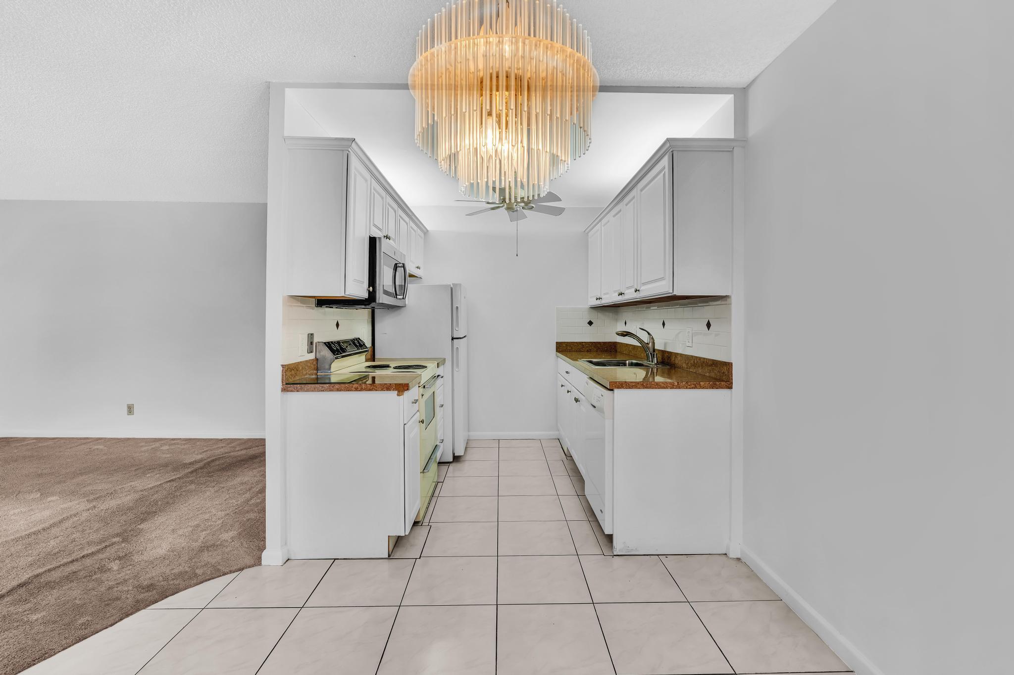 2066 Exeter Boca Raton, FL 33434 - Photo 9 of 60 a view of kitchen with cabinets