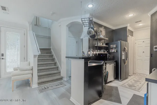 a view of a kitchen and dining room