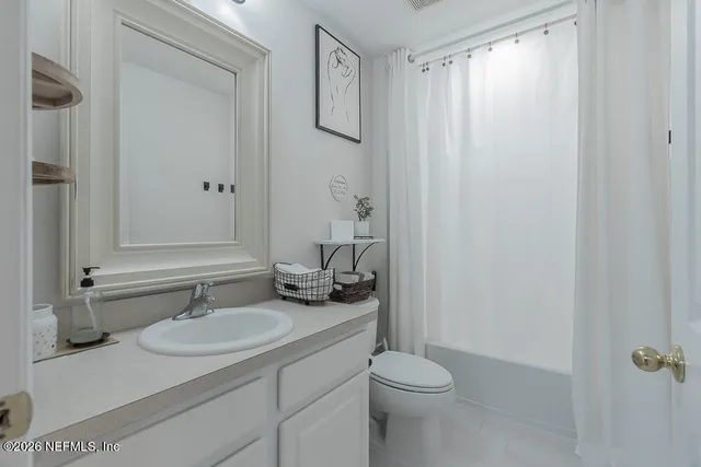 a en suite bathroom with a sink and a mirror