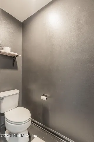 a bathroom with a toilet a sink and a shower