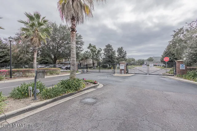 a view of outdoor space with garden and signage