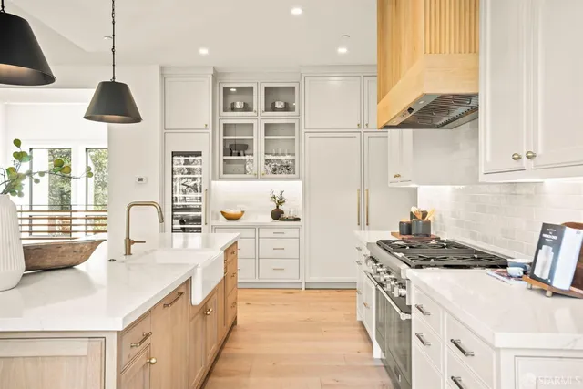 a bedroom with furniture and a large window