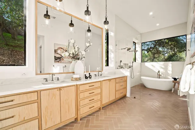 a view of balcony with two chairs and a large window