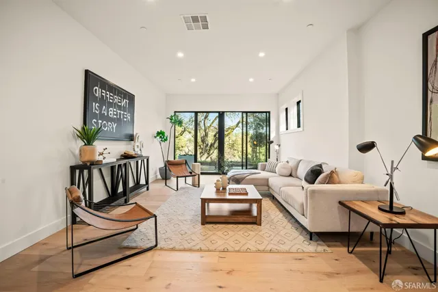 a bathroom with a double vanity sink toilet and shower
