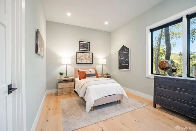 a front view of a house with a garden and pathway