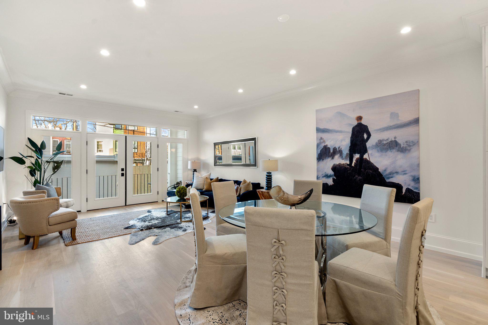 634 F Street Northeast Washington, DC 20002 - Photo 14 of 57 a living room with furniture and a large window