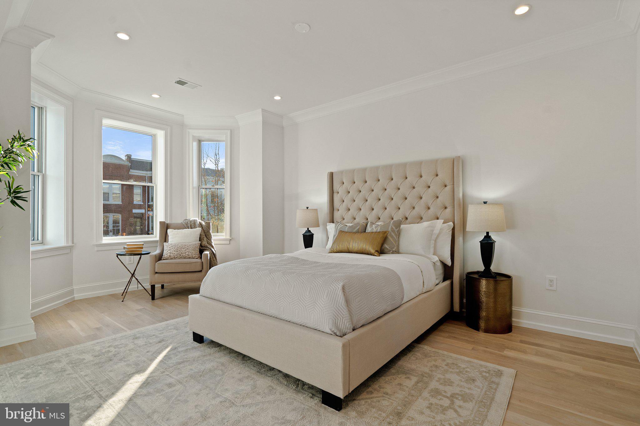 634 F Street Northeast Washington, DC 20002 - Photo 24 of 57 a bedroom with a bed and large window