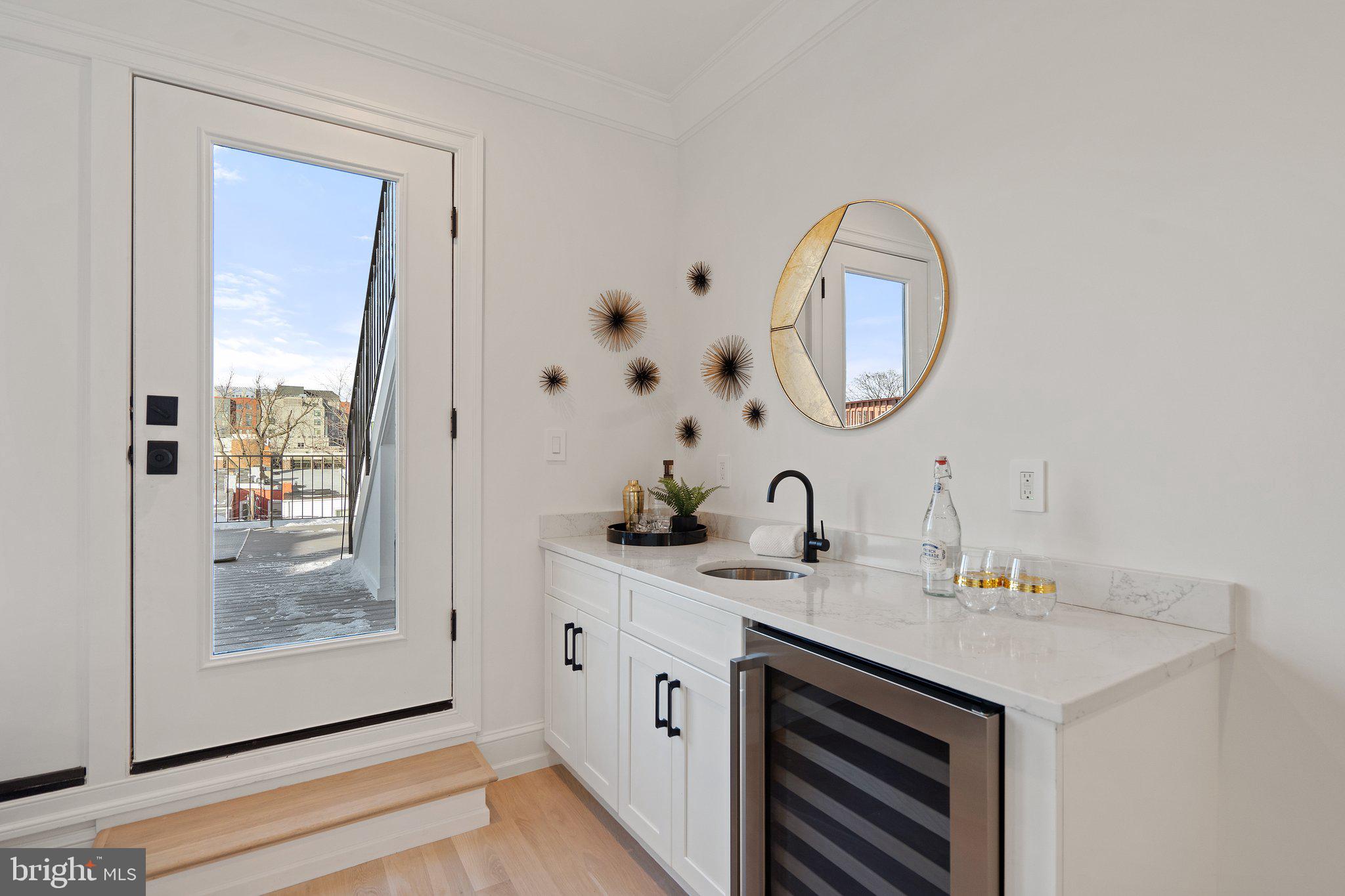 634 F Street Northeast Washington, DC 20002 - Photo 39 of 57 a bathroom with a sink and a mirror