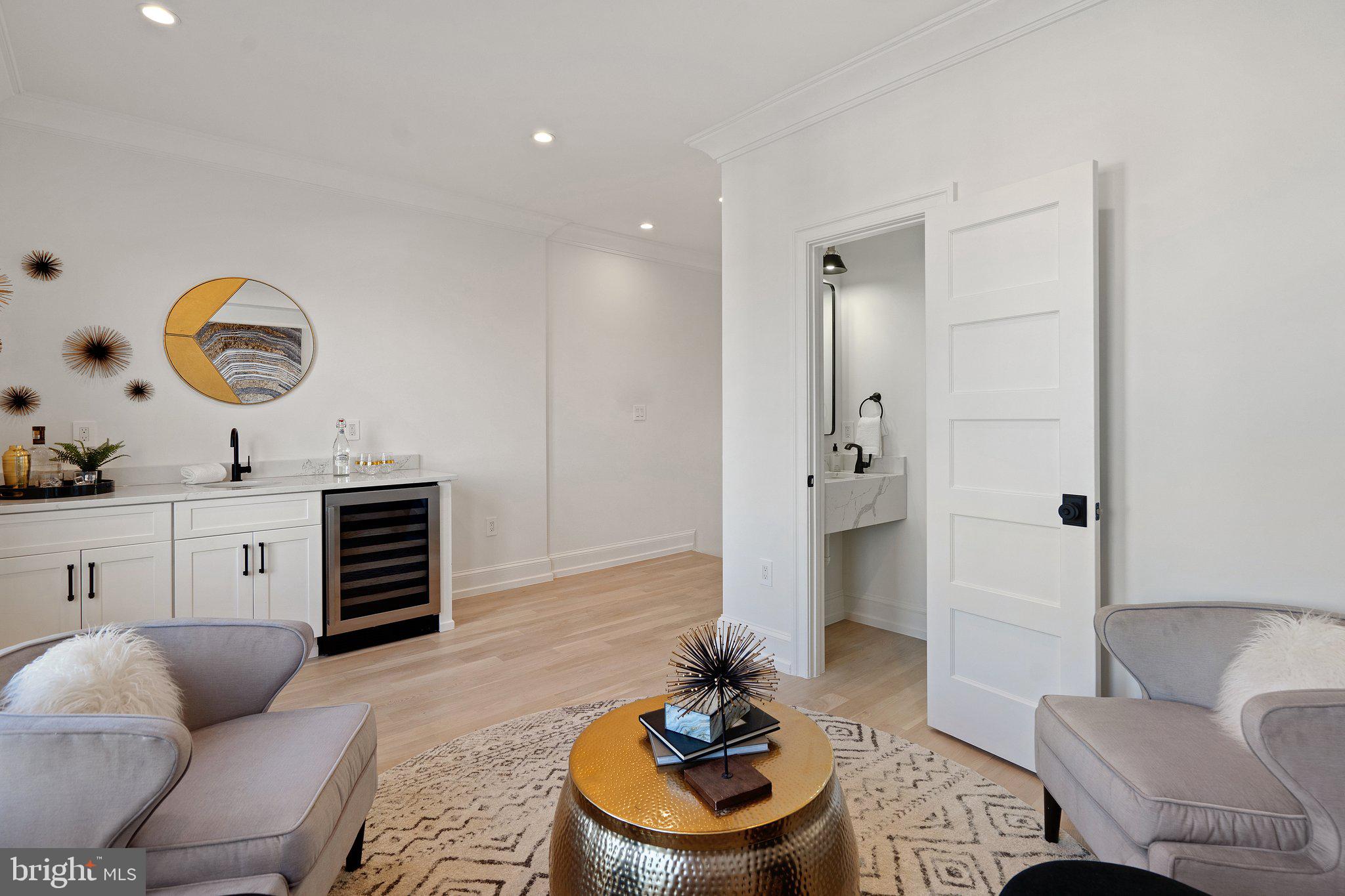 634 F Street Northeast Washington, DC 20002 - Photo 40 of 57 a living room with furniture and a large window