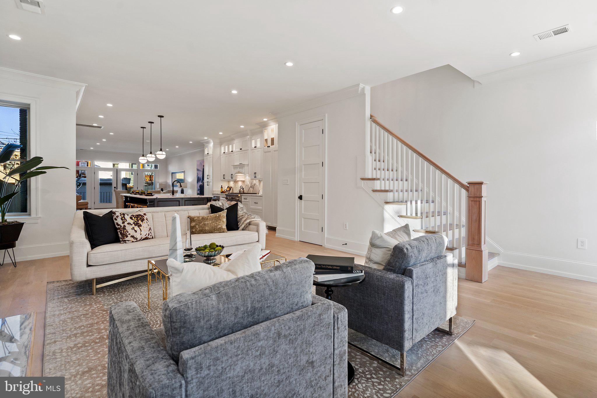 634 F Street Northeast Washington, DC 20002 - Photo 57 of 57 a living room with furniture and a dining table with kitchen view
