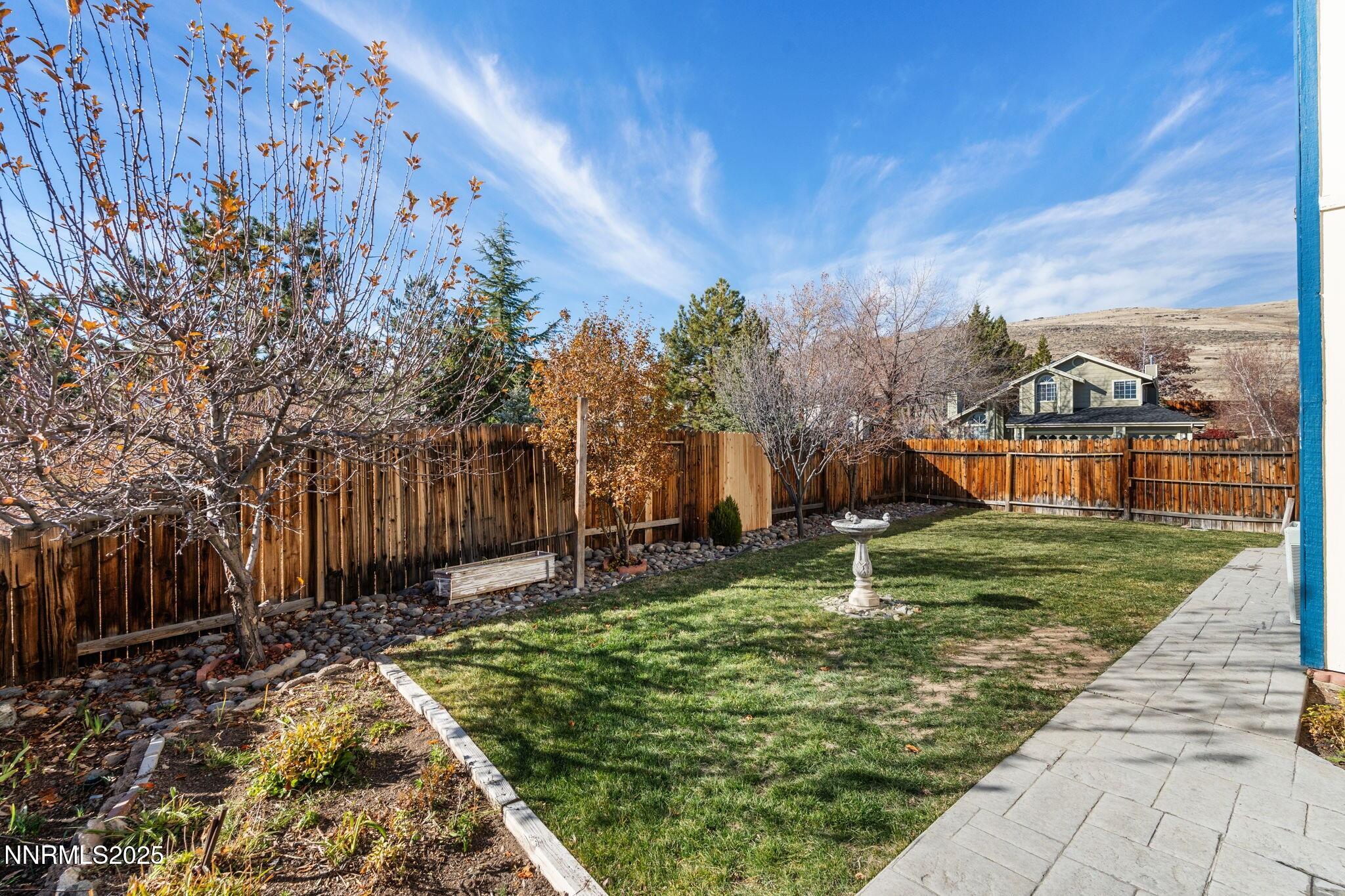 3952 Regal Drive Reno, NV 89503 - Photo 16 of 16 a backyard of a house with lots of green space