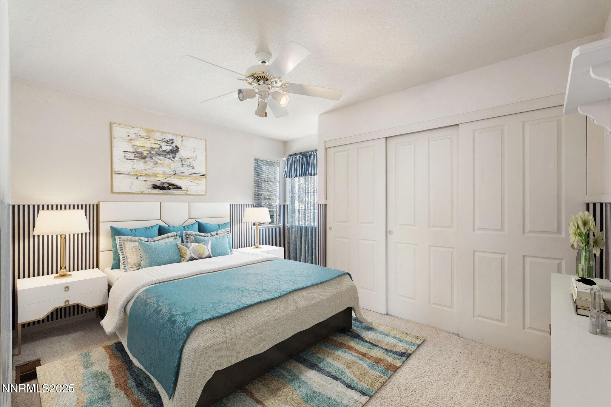 3952 Regal Drive Reno, NV 89503 - Photo 10 of 16 a bedroom with a large bed and a chandelier