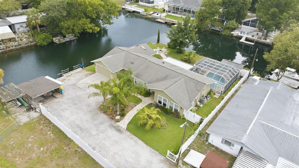 an aerial view of a house with a ocean view
