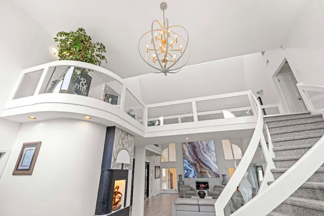 a very nice looking room with a large window and furniture