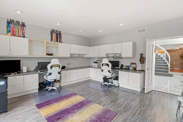 a kitchen with stainless steel appliances a sink stove and cabinets