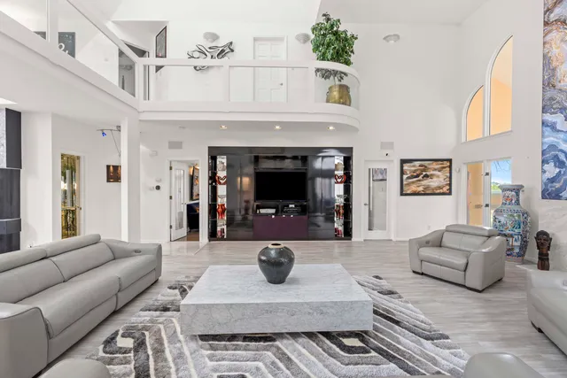 a large kitchen with a table and chairs