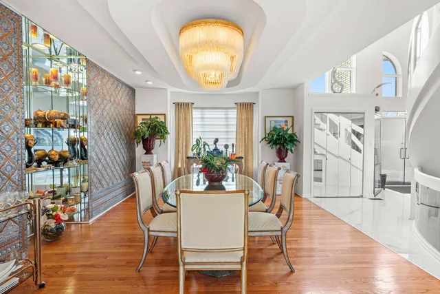 a living room with a couch a fireplace and a large window