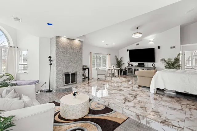 a kitchen with granite countertop a sink stainless steel appliances and counter space