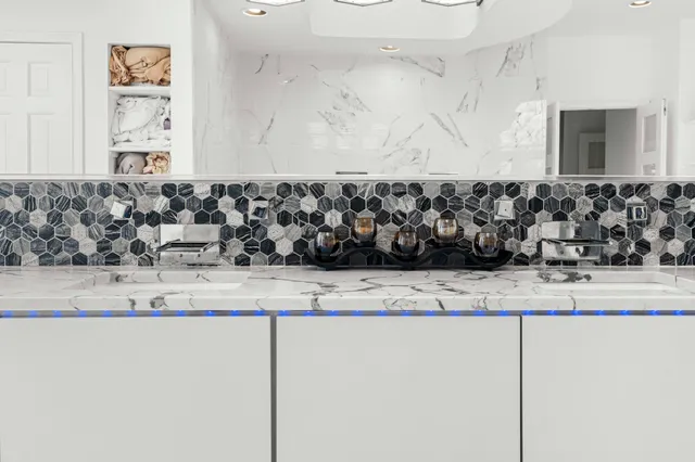 a living room with furniture flat screen tv and a large window