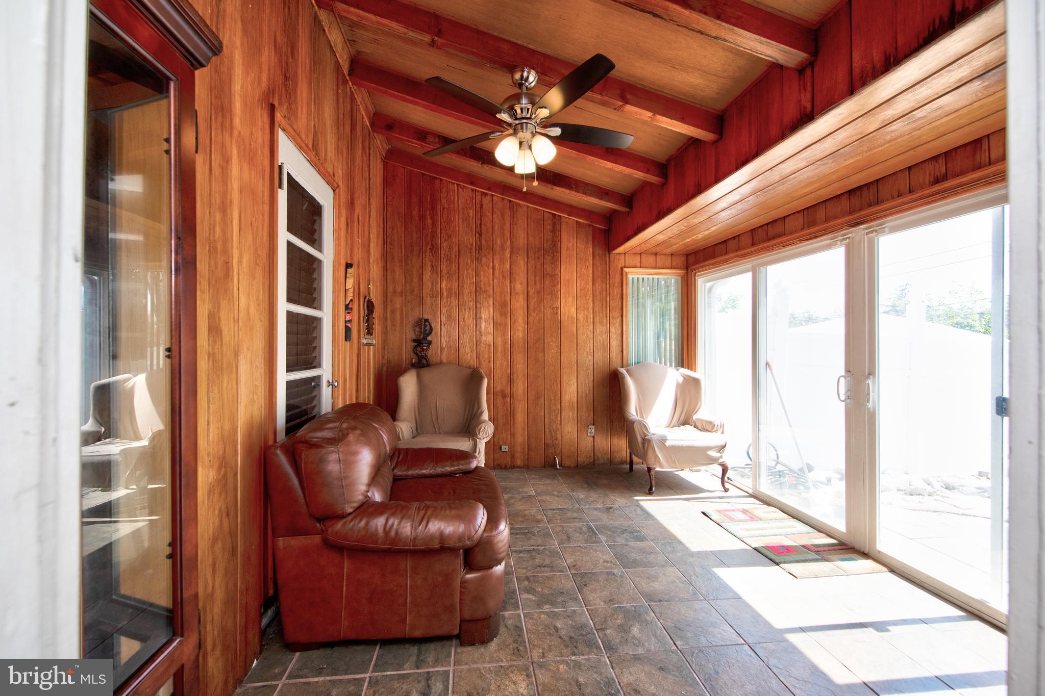 5907 Wakehurst Way Baltimore, MD 21239 - Photo 12 of 30 Main Level sunroom