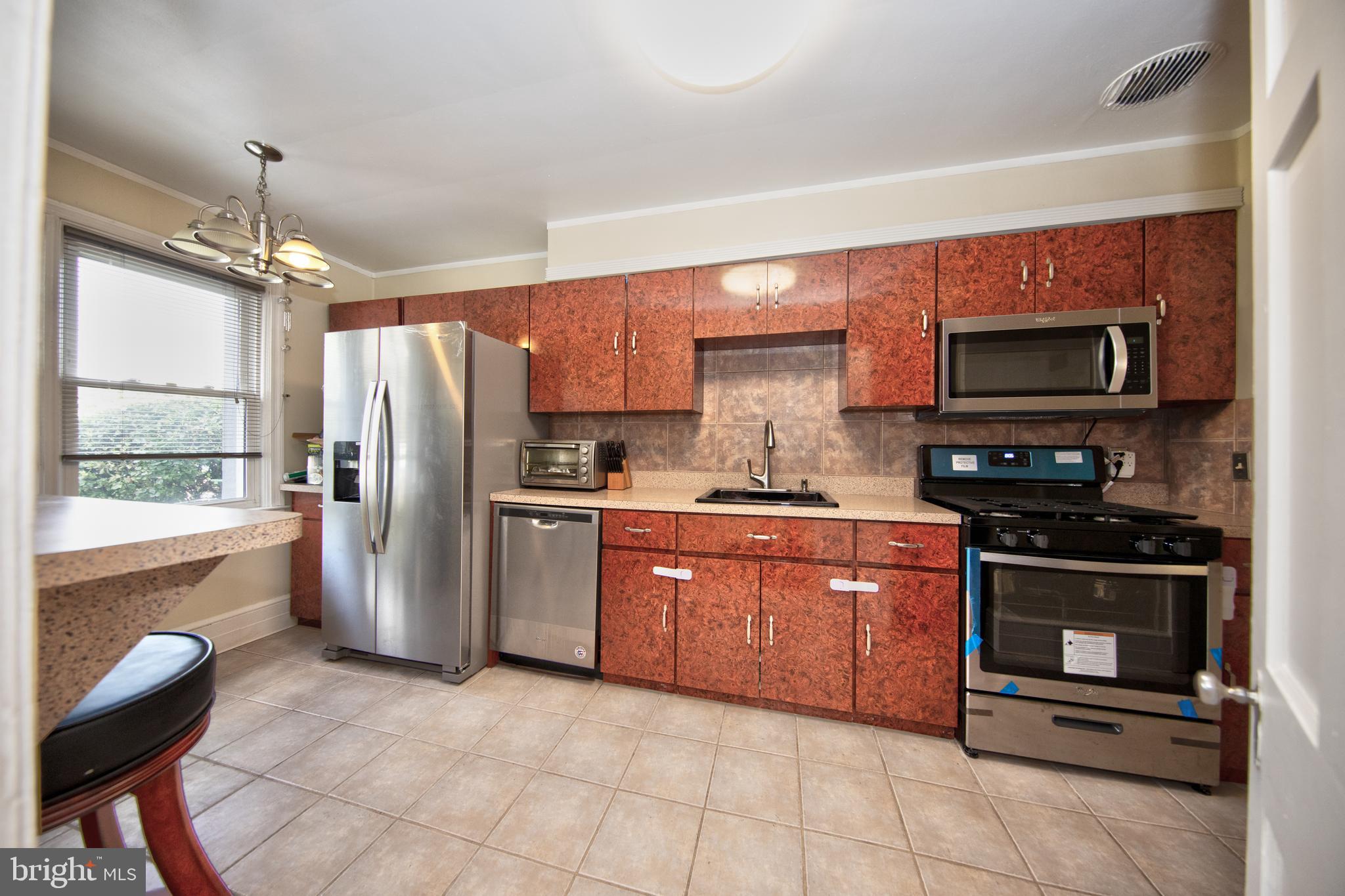 5907 Wakehurst Way Baltimore, MD 21239 - Photo 4 of 30 Kitchen with SS appliances