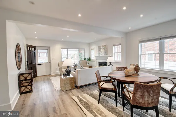 a living room with furniture a wooden floor and a window