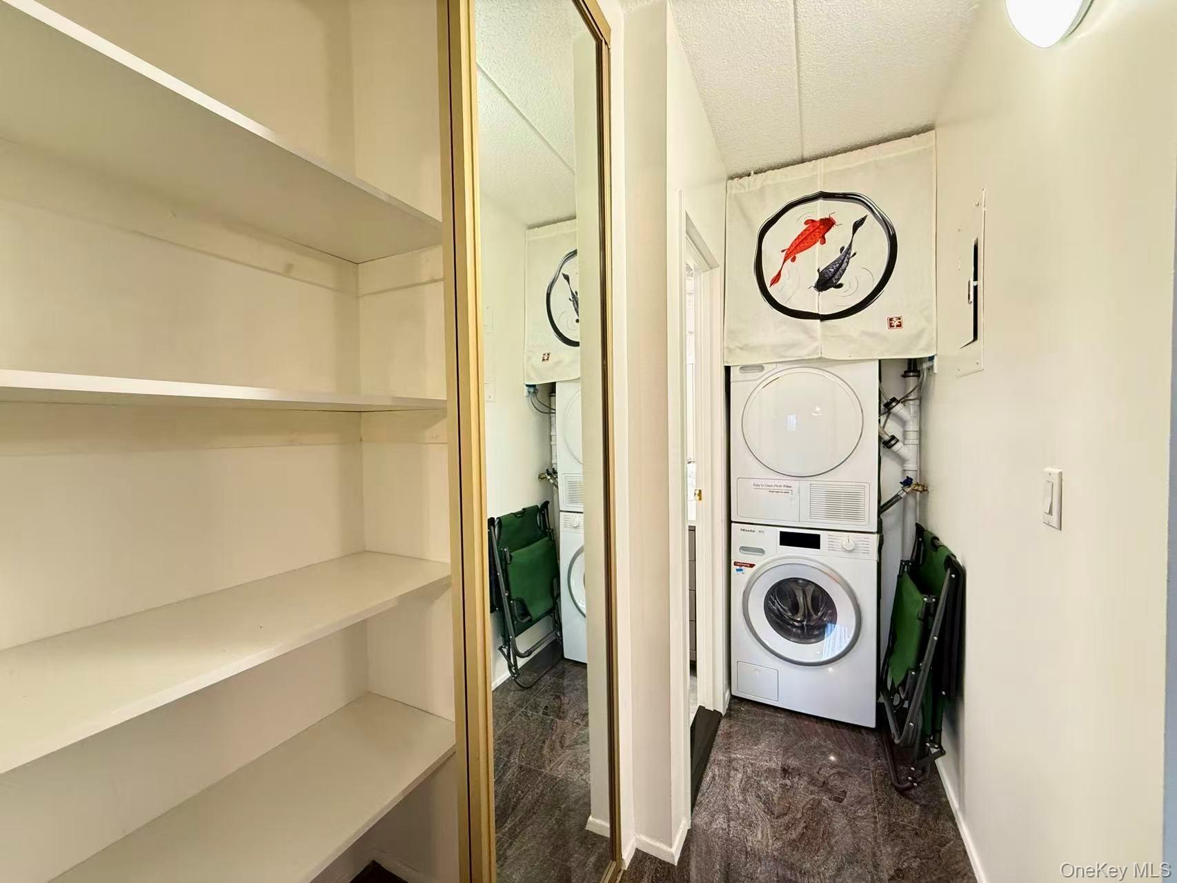 42-42 Union Street, Unit 9PHC Queens, NY 11355 - Photo 9 of 21 a view of storage and utility room with washer and dryer