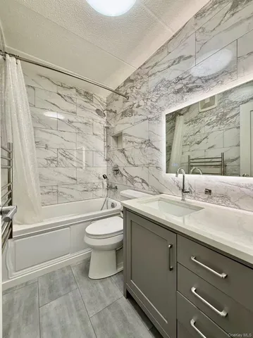 a view of a hallway with washer and dryer