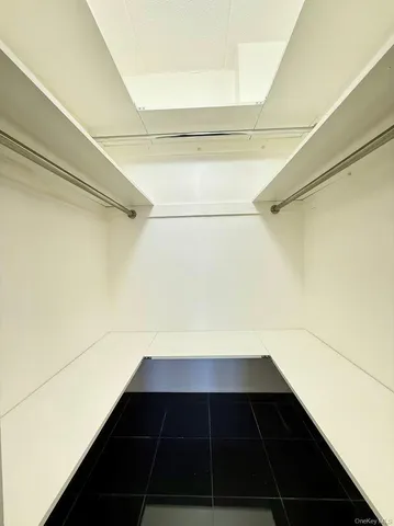 a bathroom with a granite countertop sink a toilet and a mirror